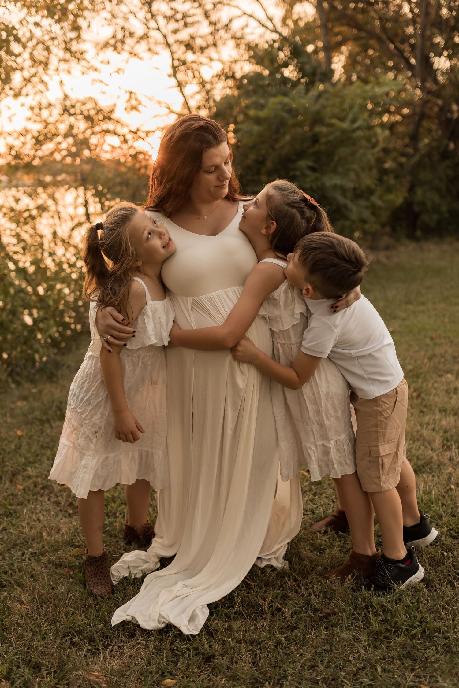 Mother enjoying a sweet outdoor family photography session with her children in Maryland during golden hour.
