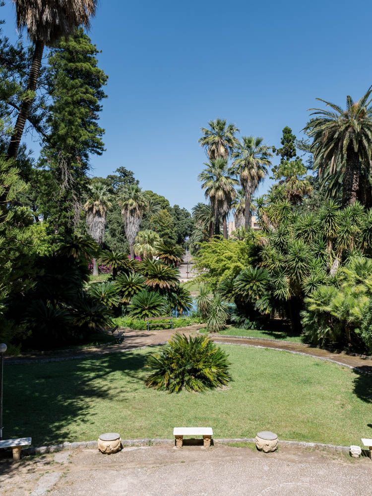 Aerial view of Villa Tasca gardens in Sicily, showcasing lush greenery and luxury wedding setting.