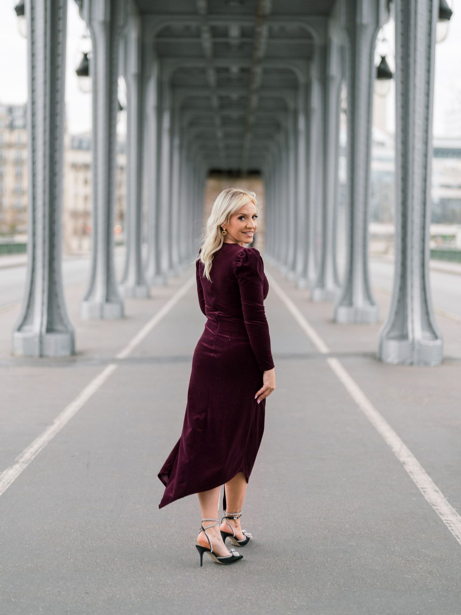 Model walking under Pont de Bir-Hakeim near Eiffel Tower, Paris, editorial wedding inspiration.