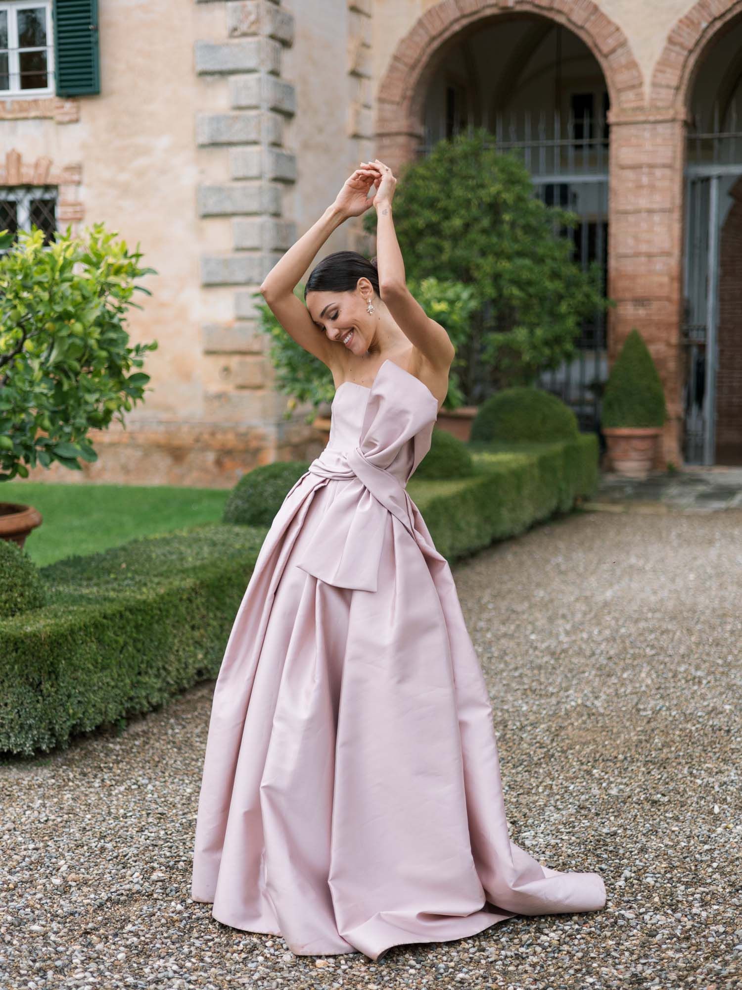 Model in light purple gown posing at Villa Cetinale, Tuscan fashion editorial.