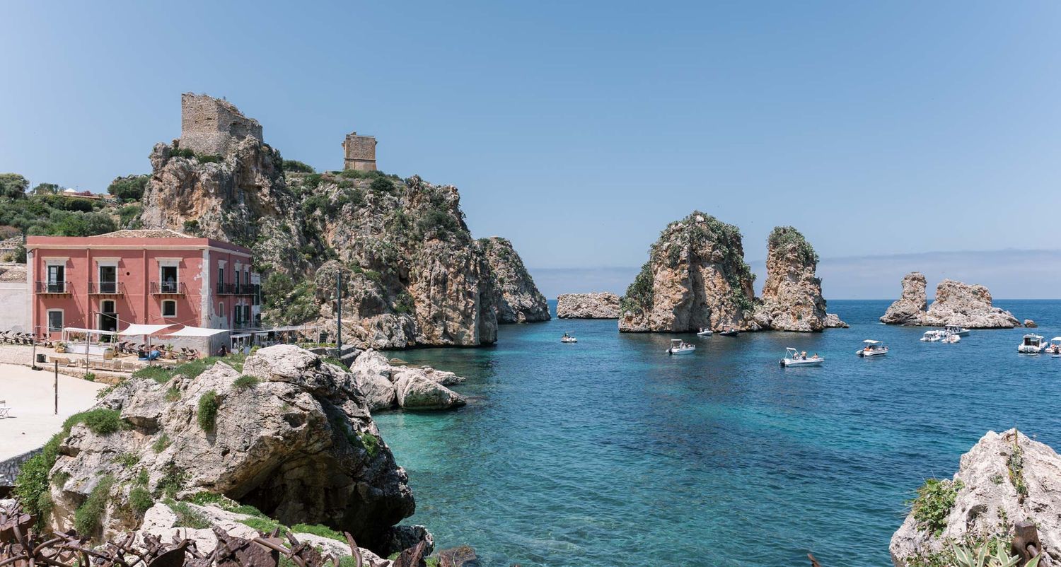 Coastal view of Tonnara di Scopello in Sicily, historic seaside venue and iconic destination wedding location in Italy.