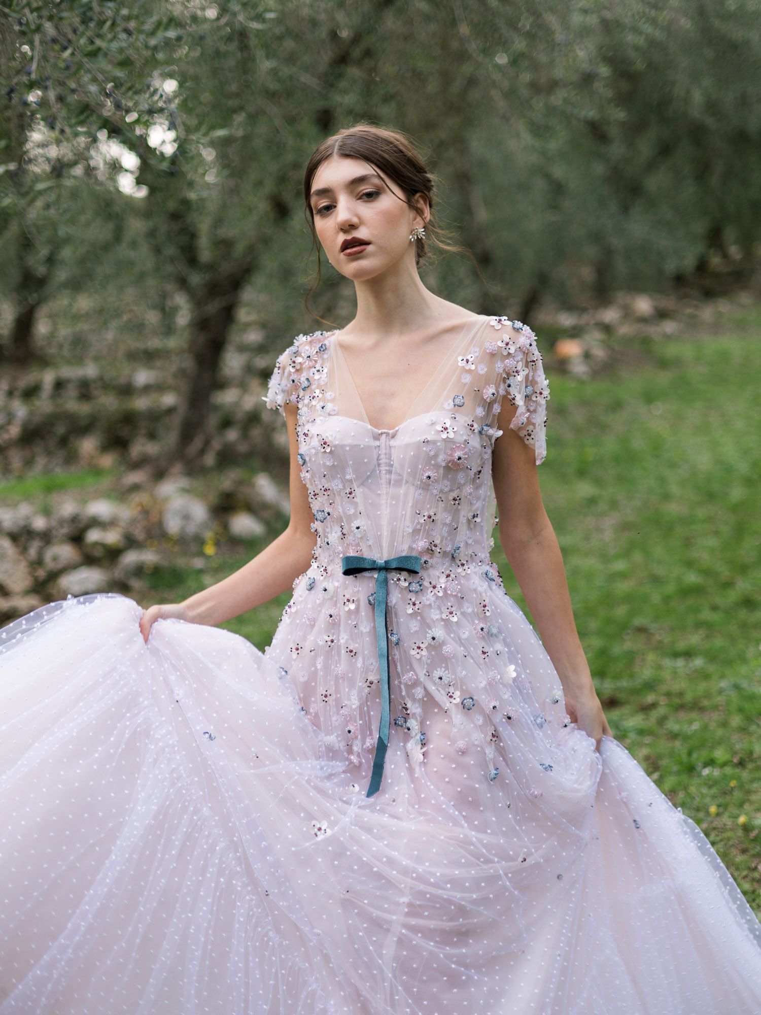 Close-up of model walking in long gown at Villa Cetinale, Tuscany, fashion editorial.
