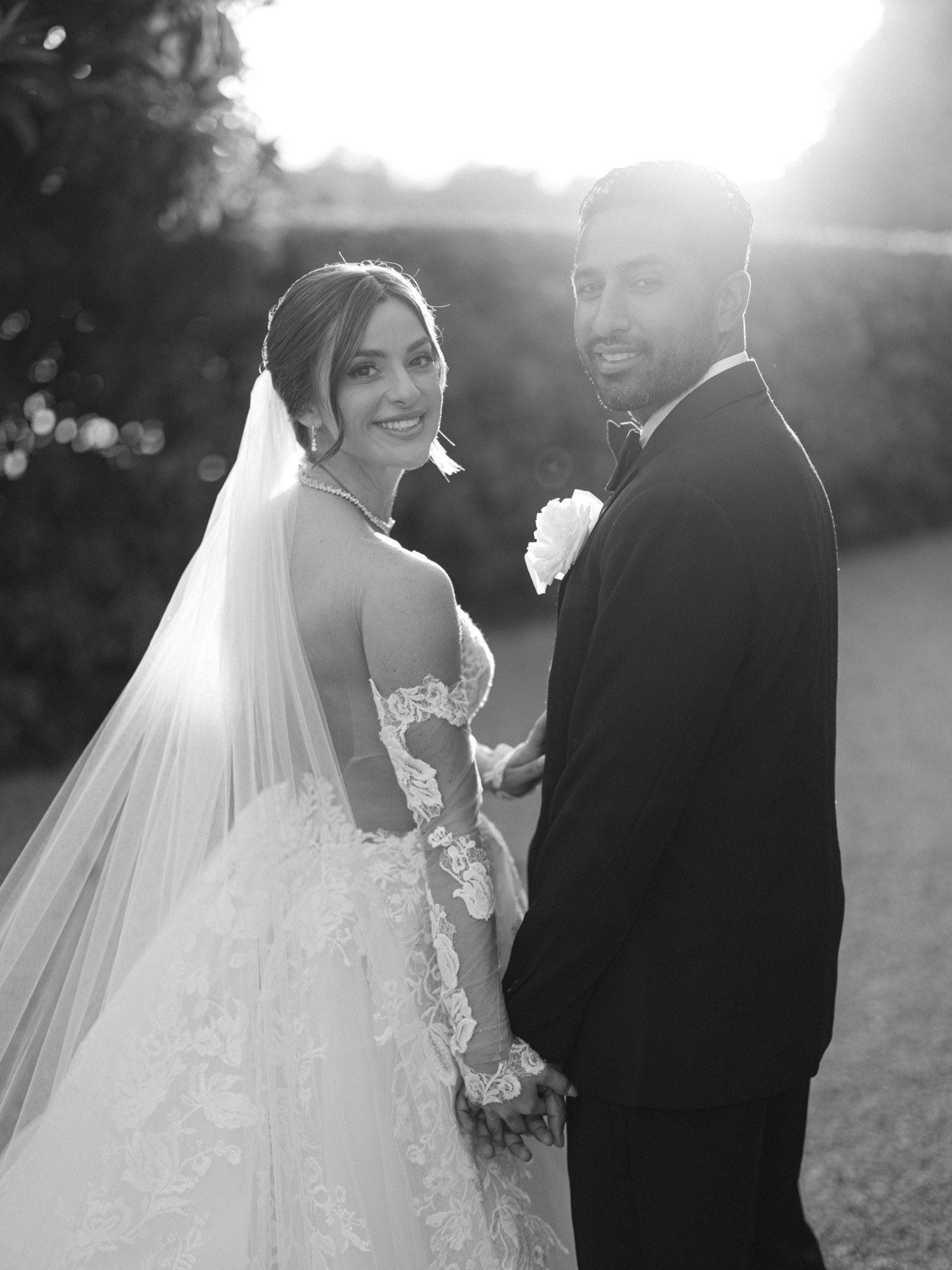 A romantic wedding photo series showing a couple in formal attire embracing during golden hour. Villa Cavazza. Isola del Garda.