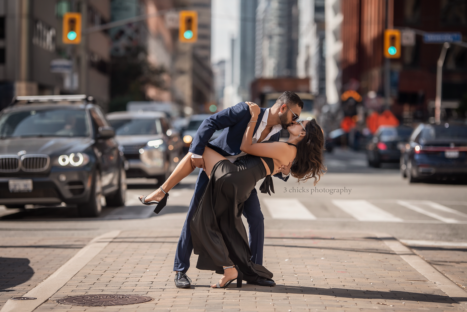 Romantic couple dancing dip on busy city street intersection at dusk. Couple photography Burlington