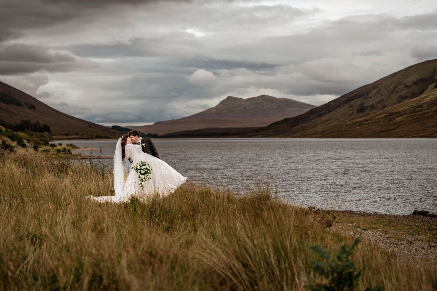 Dramatic Scottish Highland landscape with mountains and lake creating a romantic wedding backdrop. Scottish Highlands Achnasheen Wedding