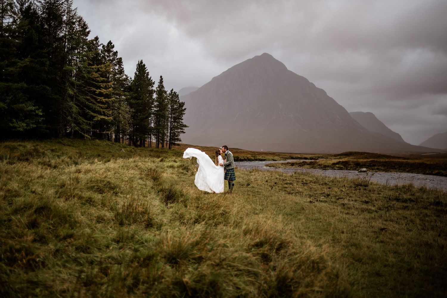 Panoramic view of a Scottish Highland landscape with mountains and evergreen trees. Kings House Hotel Wedding Photography