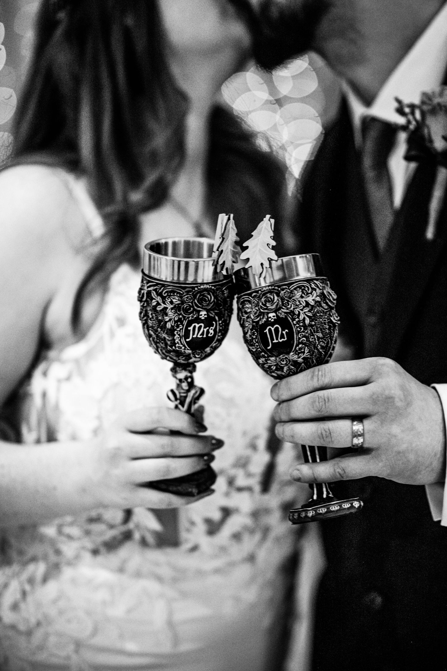 Wedding couple toasting with ornate silver goblets during their reception celebration. Glen Mhor Hotel Inverness Wedding photography