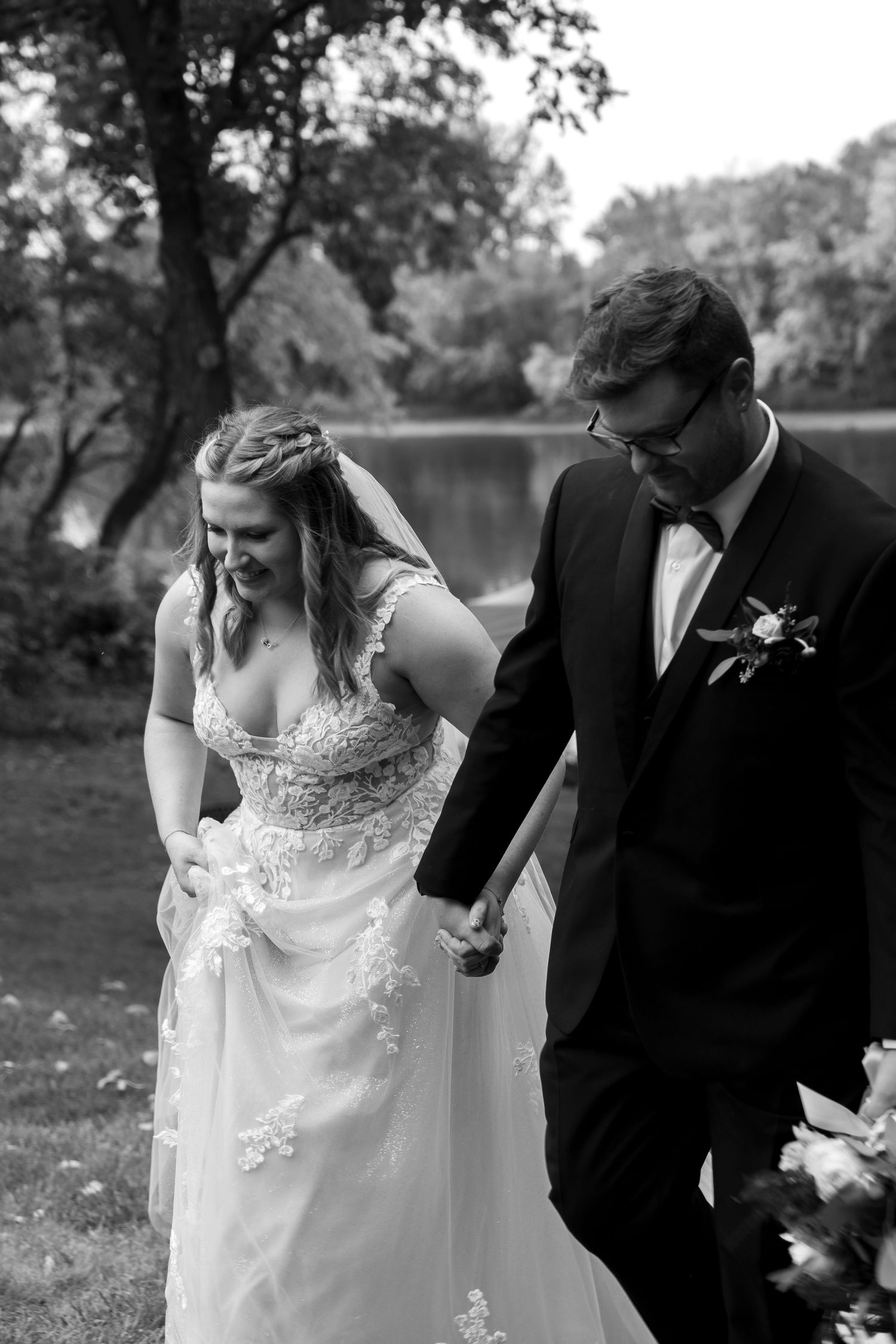 A wedding couple shares tender moments together in an outdoor setting.
