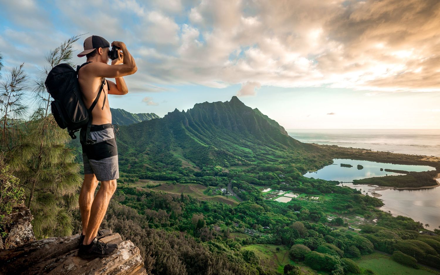 Scenic mountain landscapes and coastal views during golden hour in Hawaii.