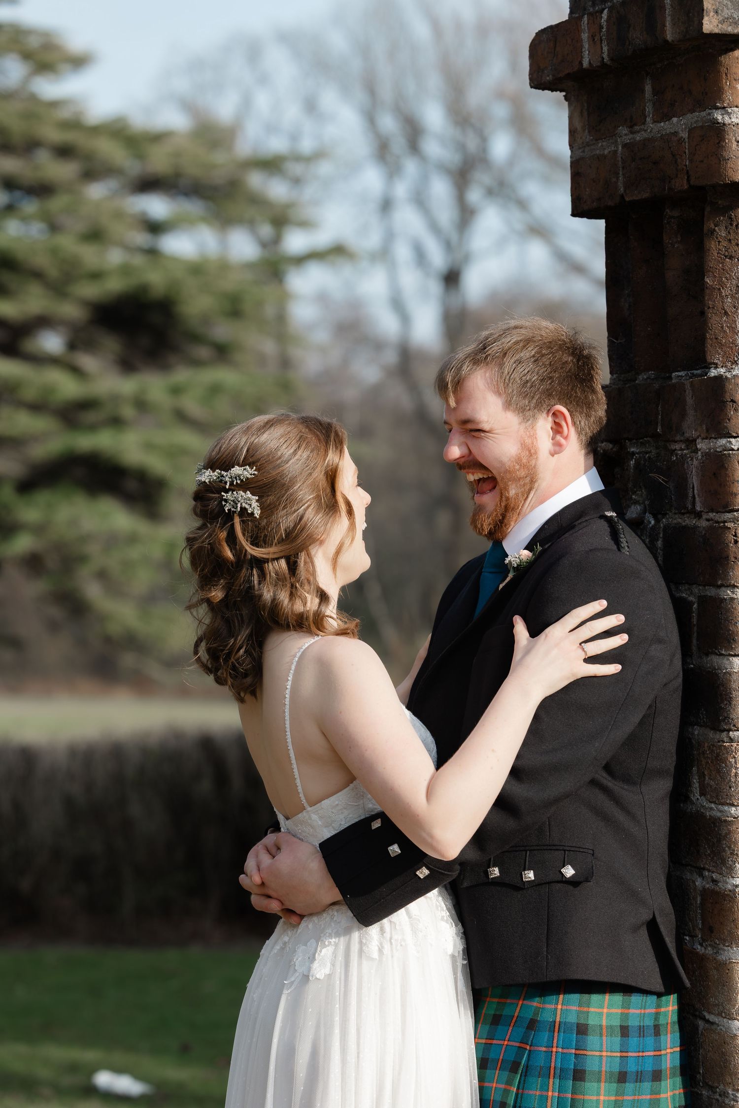 A romantic sequence of wedding photos showing a couple embracing and laughing together against a brick wall backdrop.