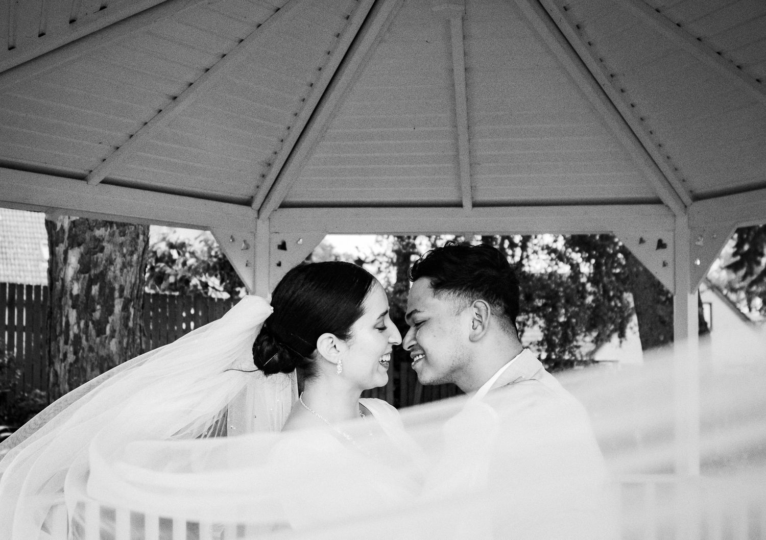 Black and white vintage wedding ceremony photos arranged in a panoramic collage showing celebration moments.