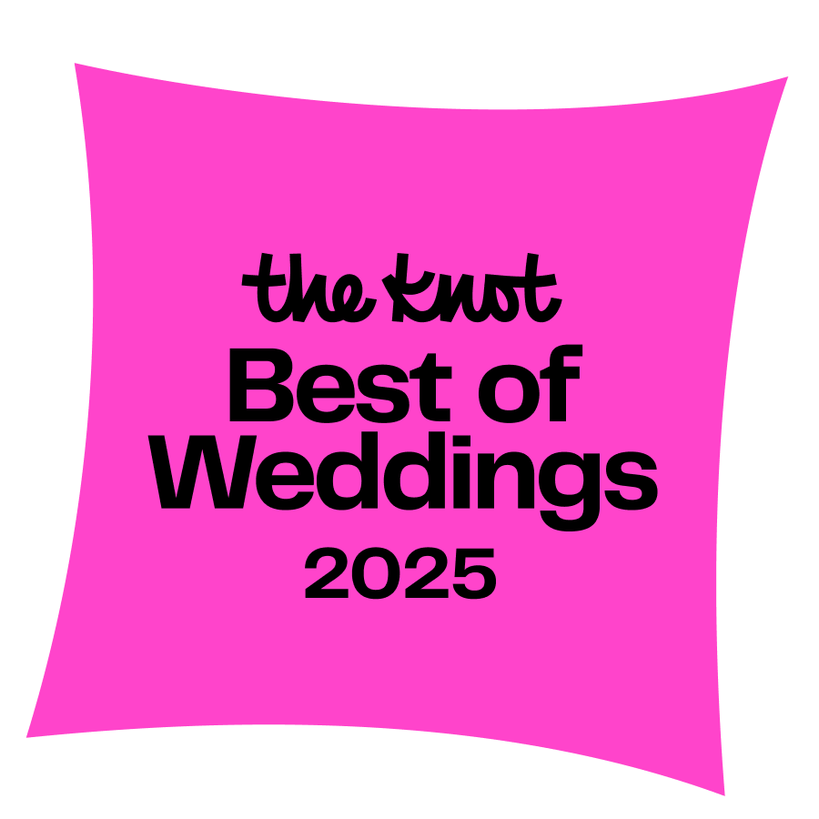 A pink square pillow featuring black text that reads 'the knot Best of Weddings 2025'.