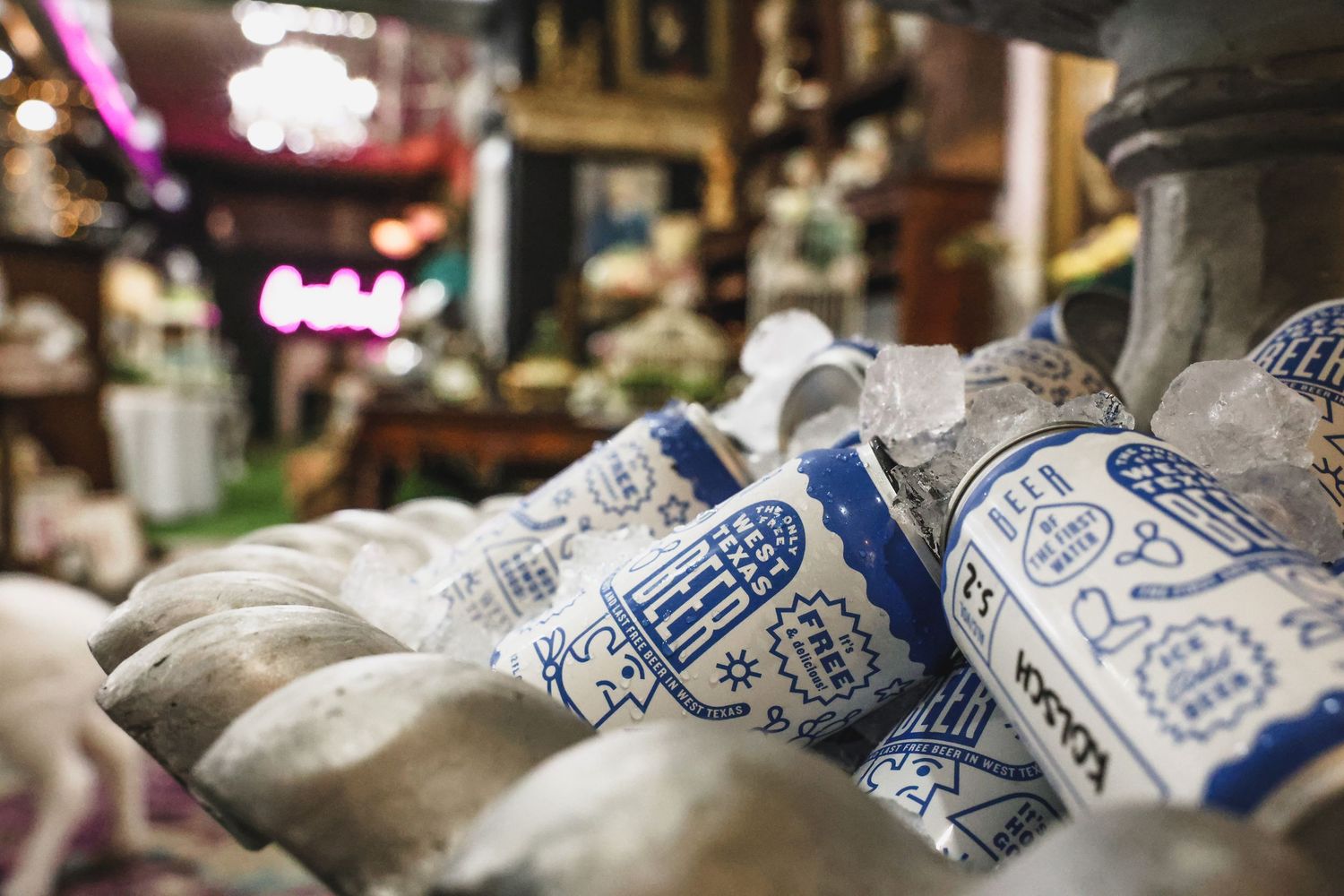 Close-up of decorative blue and white ceramic vessels displayed in an antique shop.