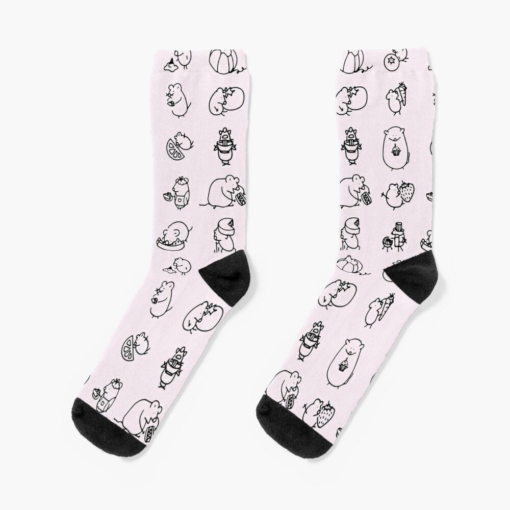 Pink socks with black toe and heel featuring cute cartoon Moomin character illustrations in various poses.