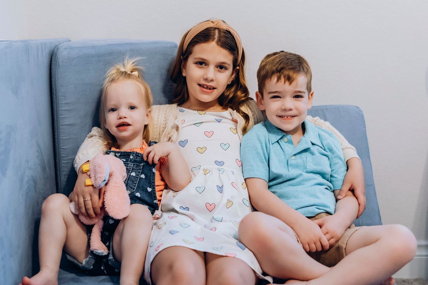 Natural light indoor family session in Houston area with relaxed candid interactions