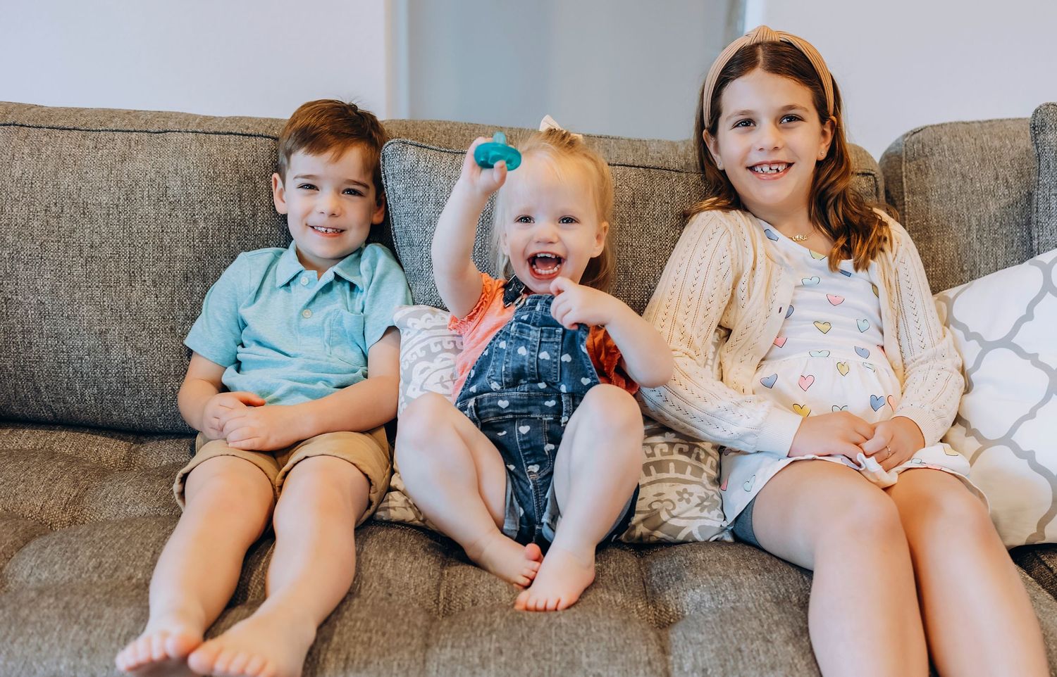 Natural light indoor family session in Houston area with relaxed candid interactions
