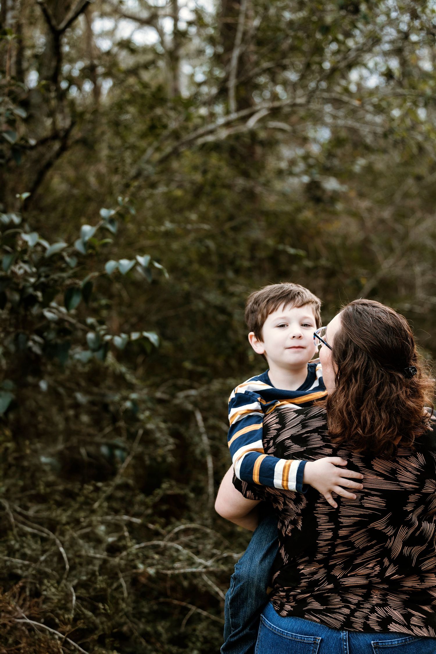 Family photography session in Pearland Texas with parents and children outdoors in natural light