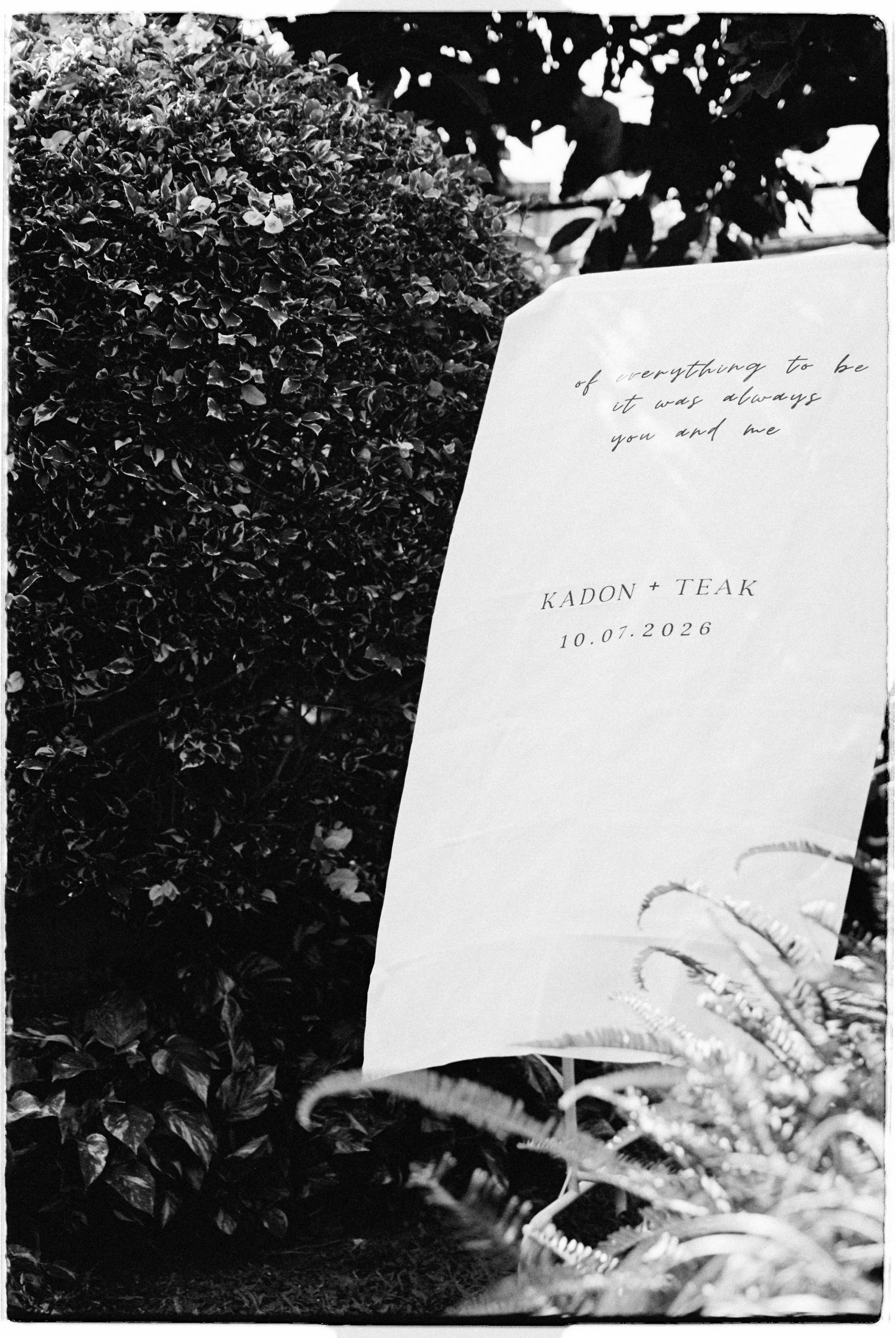 Black and white photo of wedding program reading if everything to be it was always you and me, Kadon and Teak 10.01.2026.