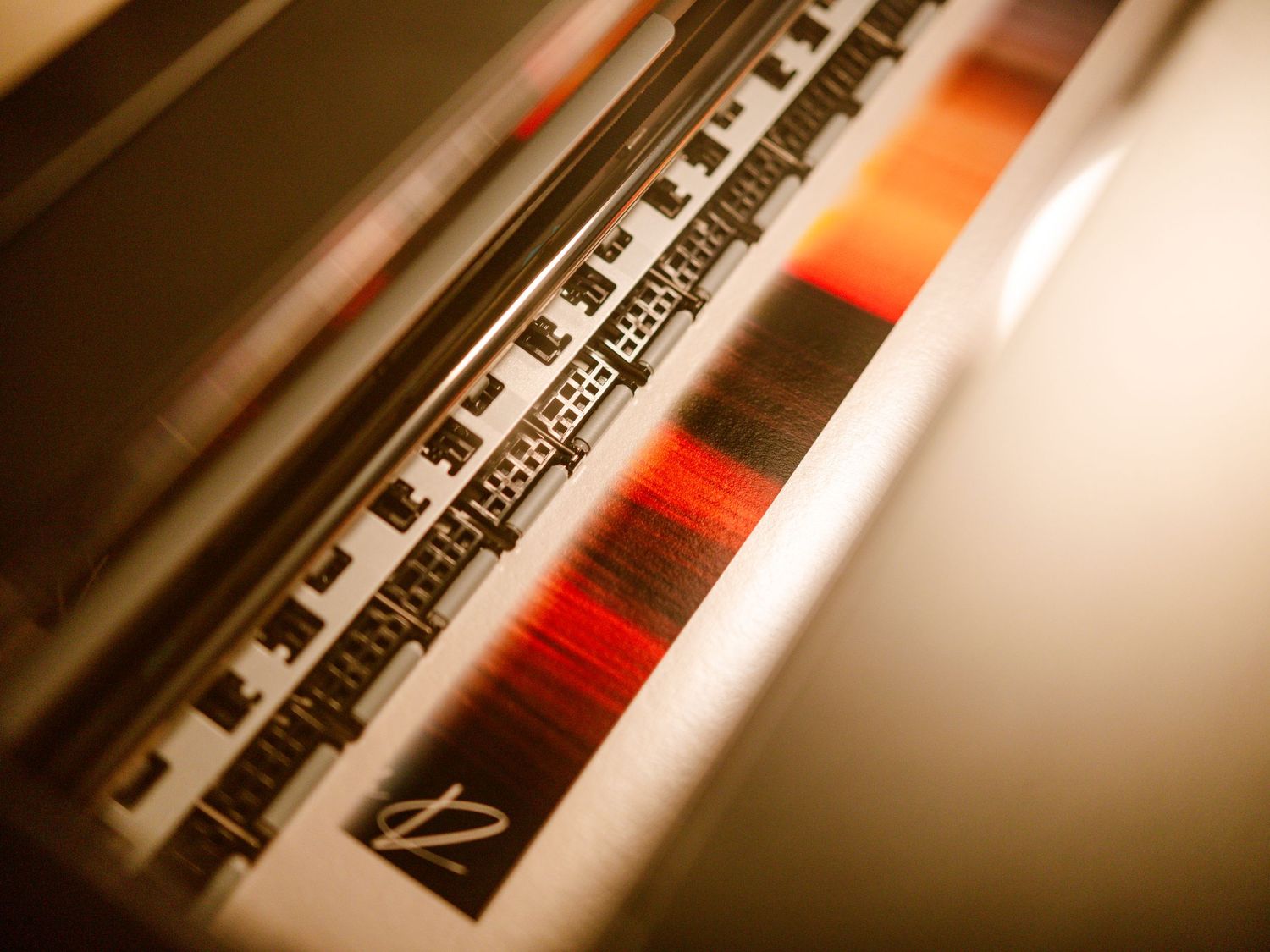 Close-up of a color calibration strip on a professional large format photo printer.