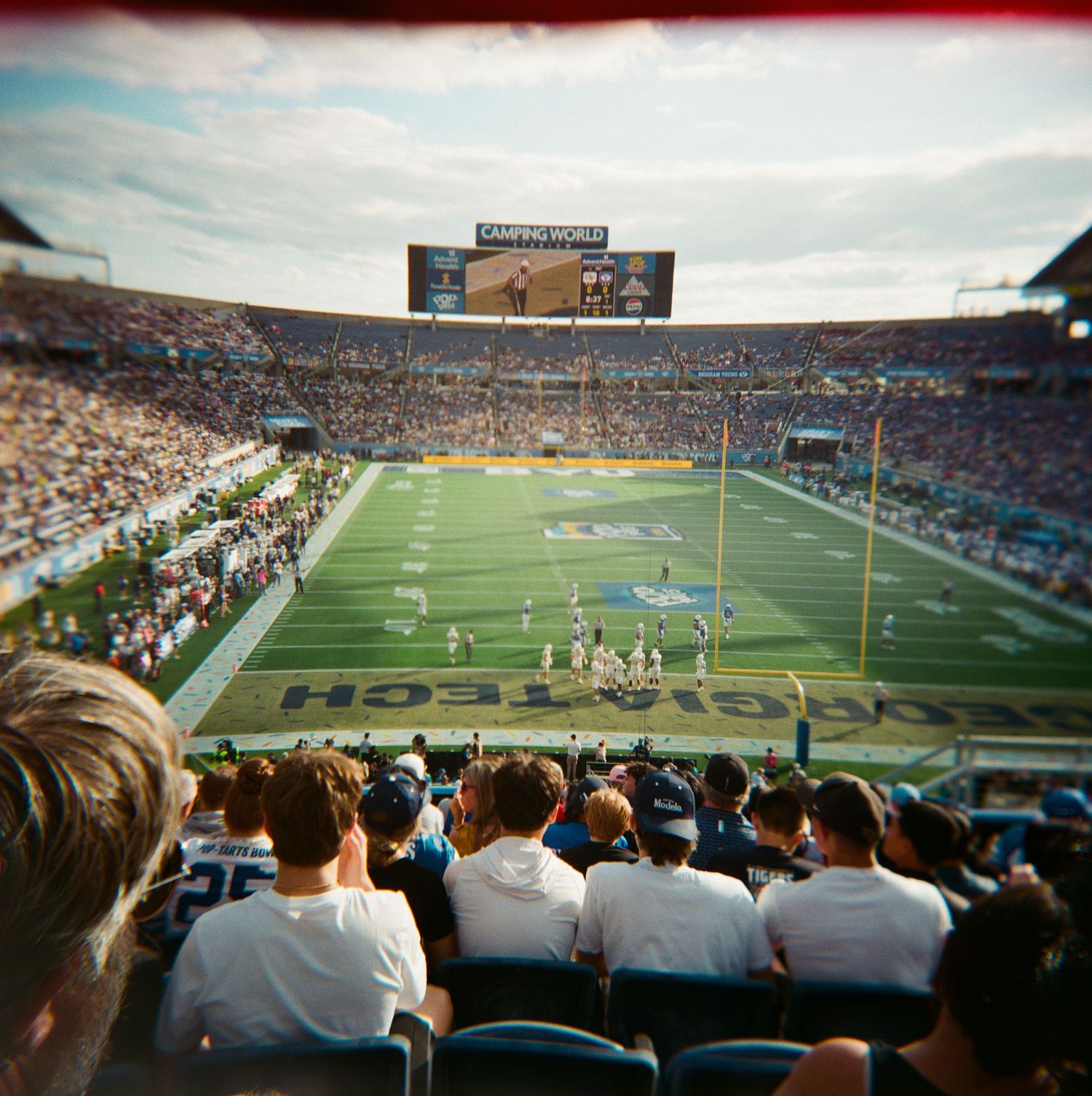 Film photo of Georgia Tech football game from end zone seats showing full stadium and field.