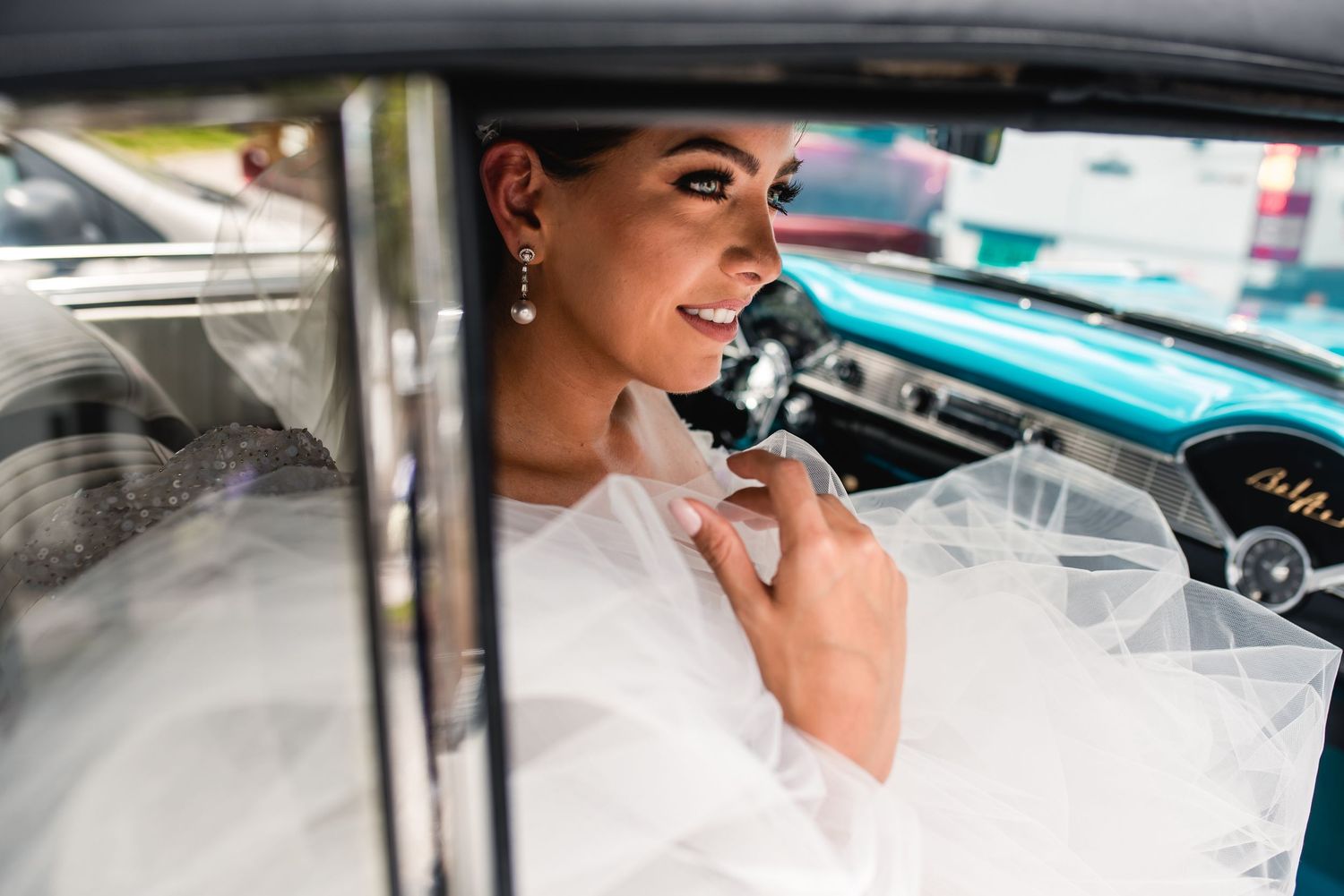 Close-up portraits of a bride getting ready in a car on her wedding day.