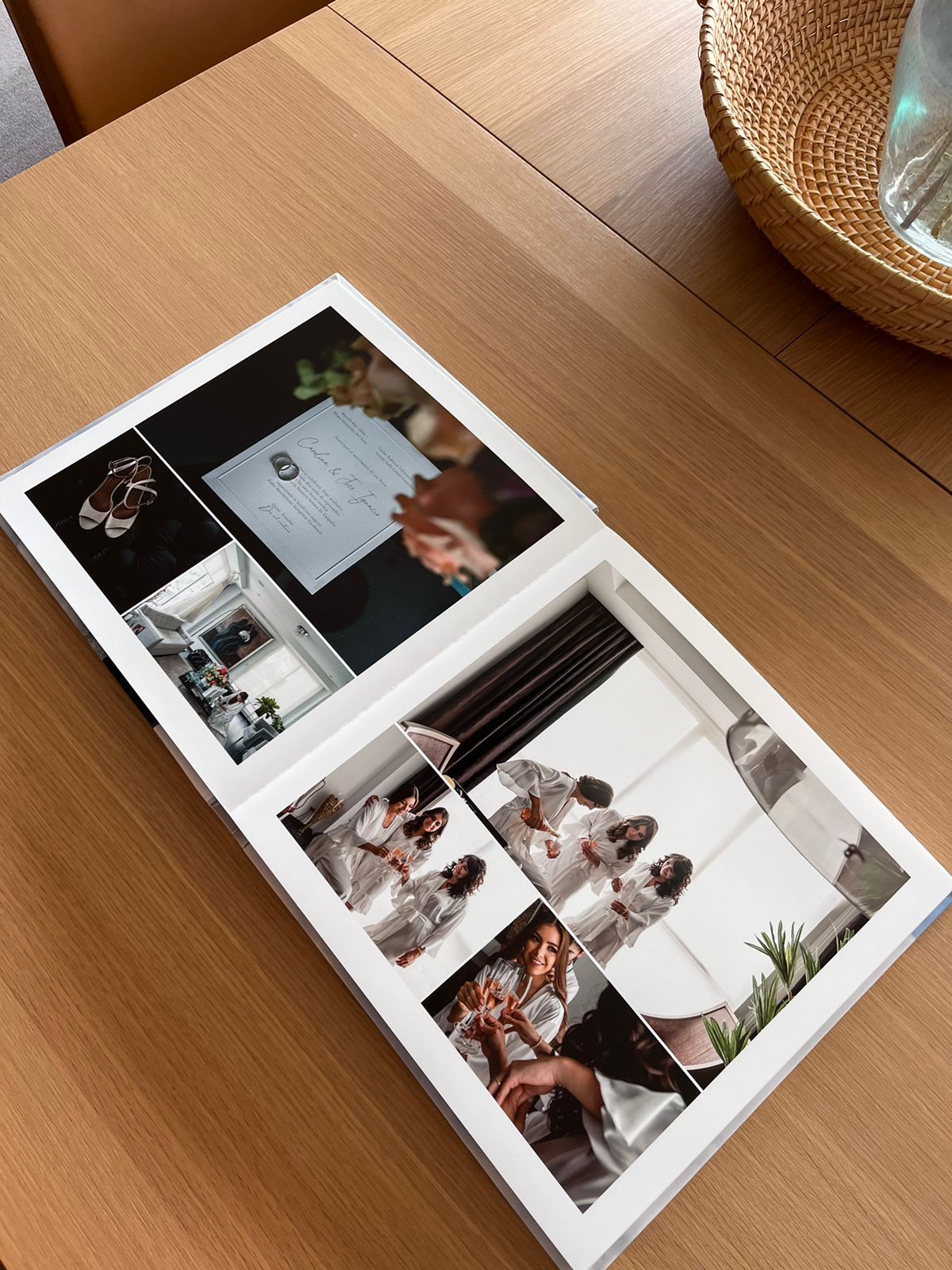 Wedding photo album displayed on wooden table showing collection of special moments.