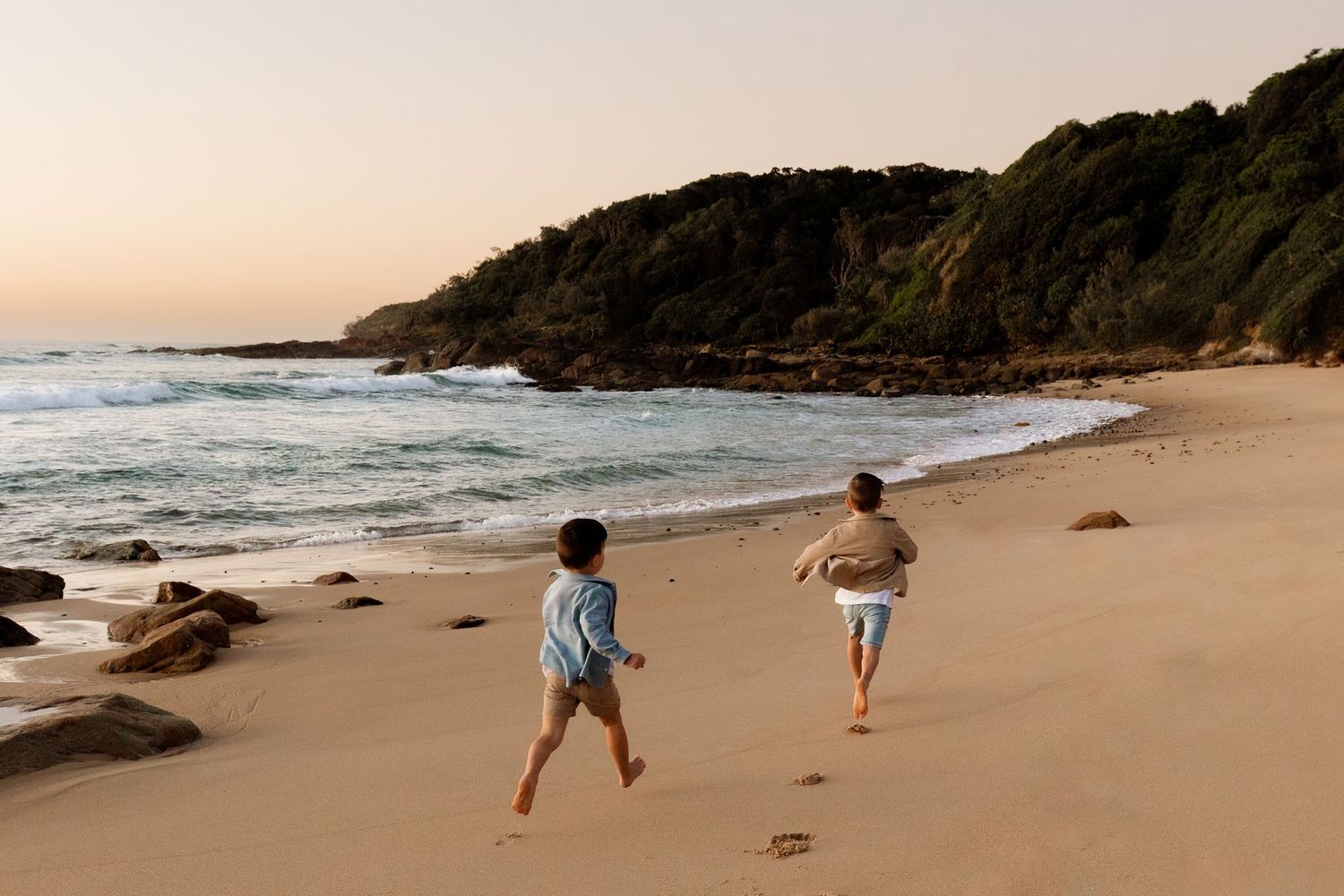boys running on beach Sunshine Coast family photo session
