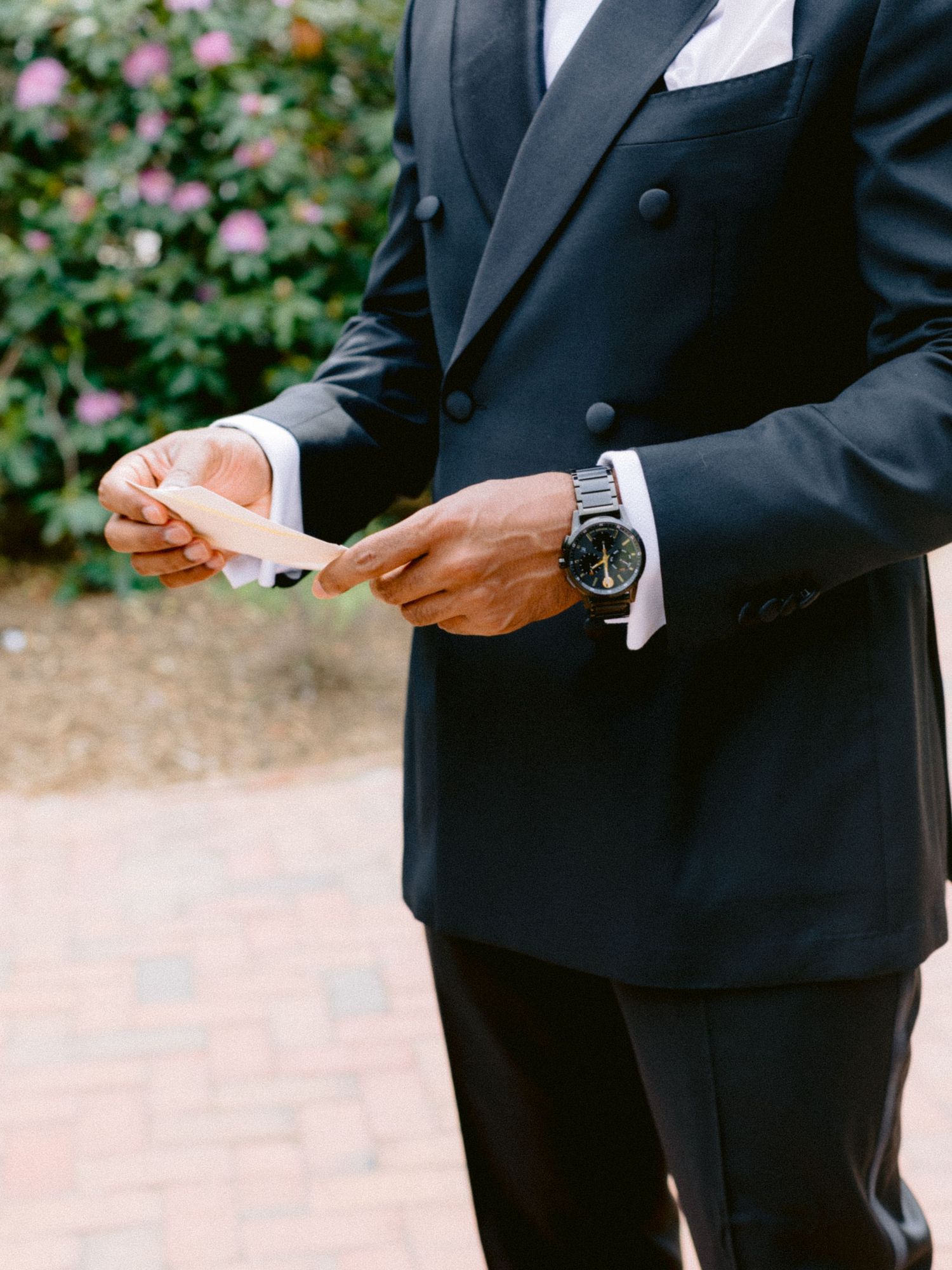 groom reading gift from bride at Hampton NY wedding