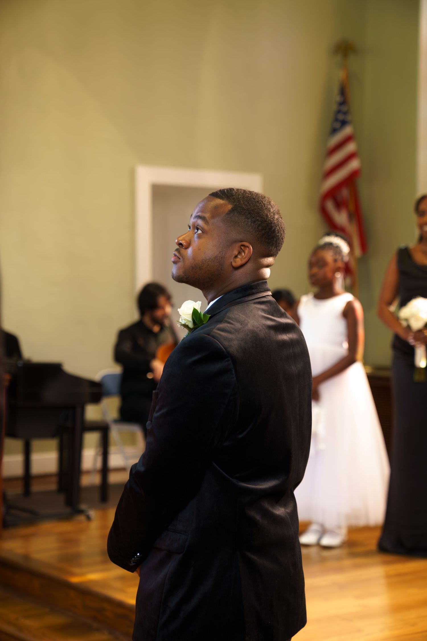 A sequence of candid wedding party moments captured in a church sanctuary with American flags in the background.