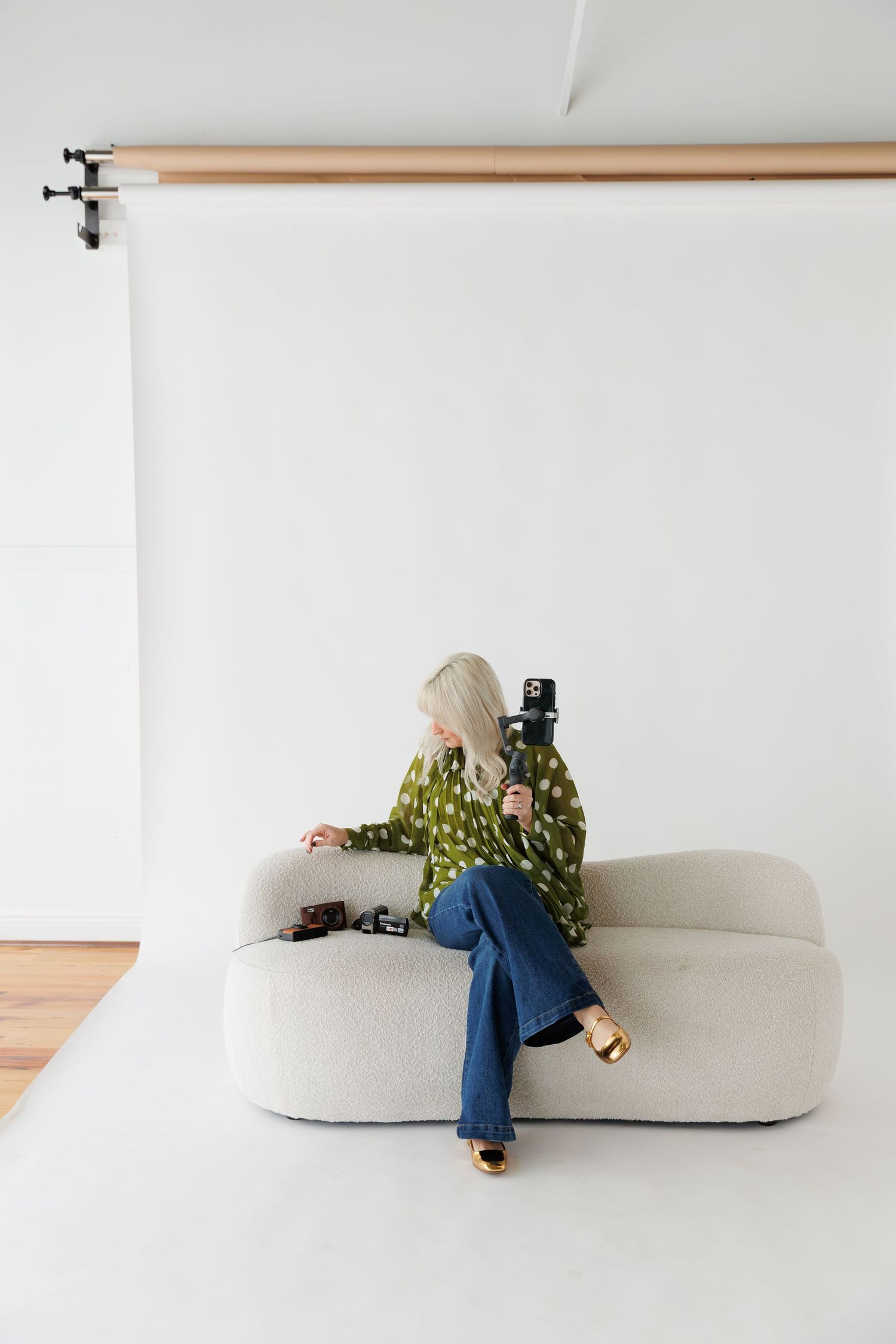 A series of photos showing a person lounging and relaxing on a minimalist beige sofa against a white wall.