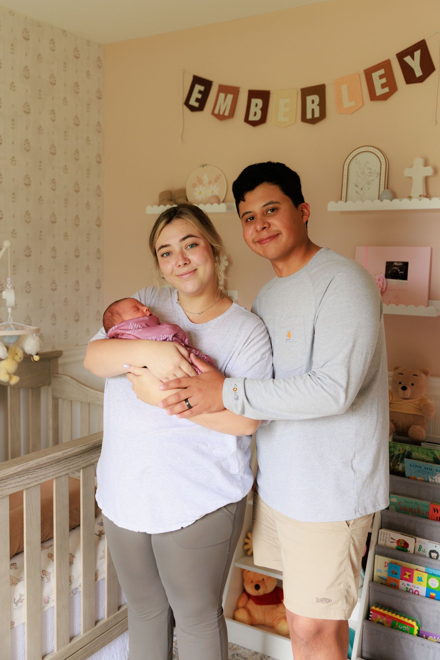 A nursery room with white crib, decorative wall letters, and people holding a baby in a series of connected photos.