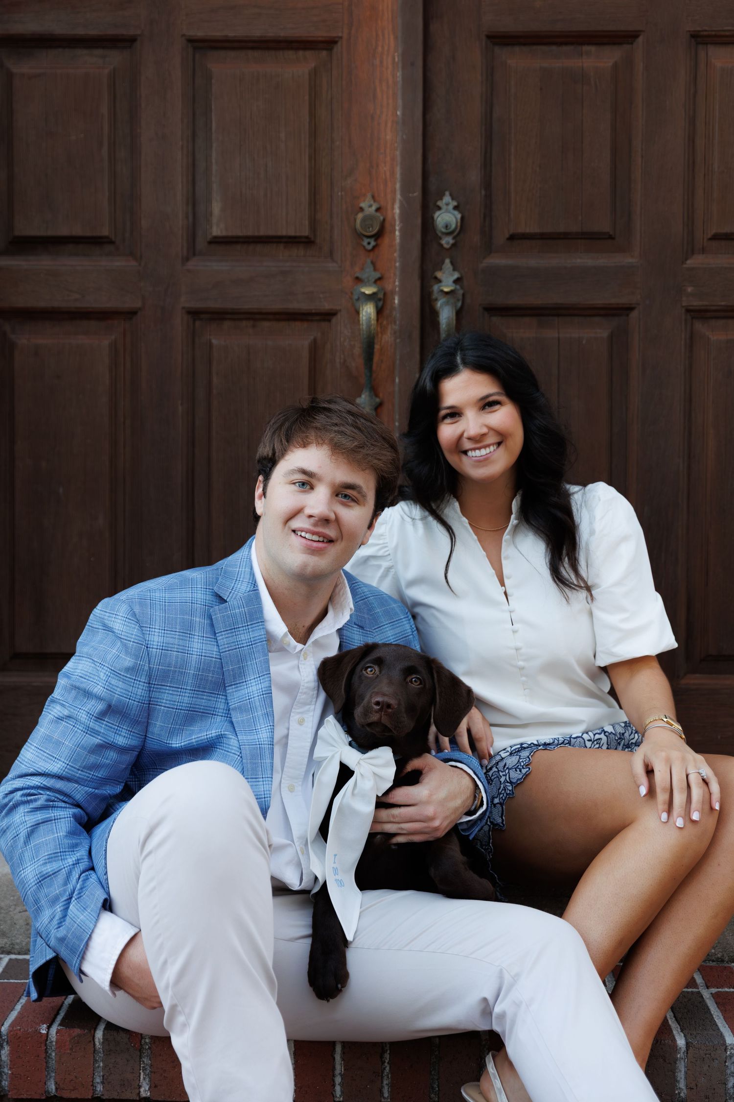 A couple sits together on wooden steps wearing coordinated blue and white outfits in a series of casual poses.