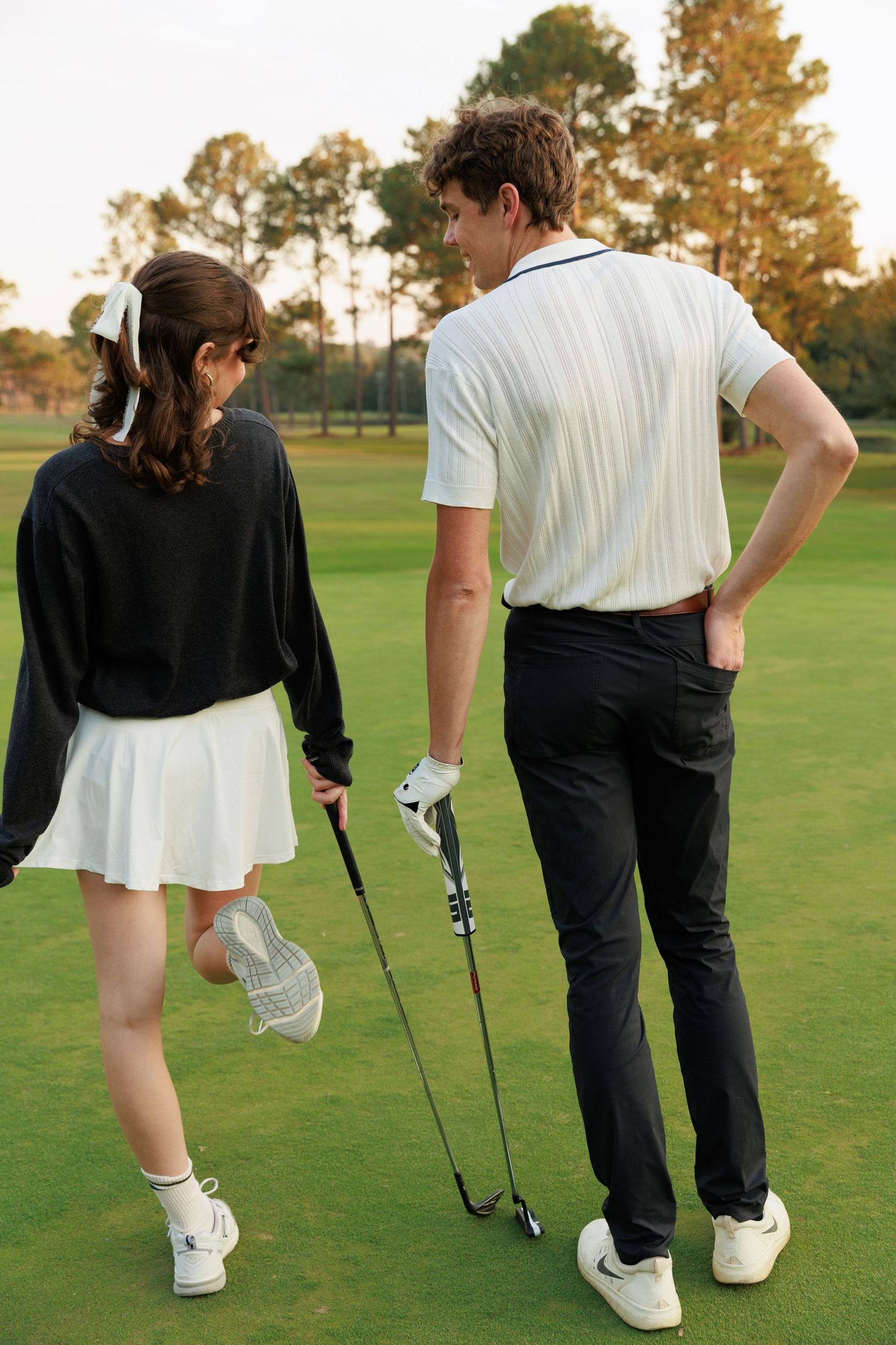 Sequence of golf instruction photos showing proper putting stance and form on a green golf course at sunset.