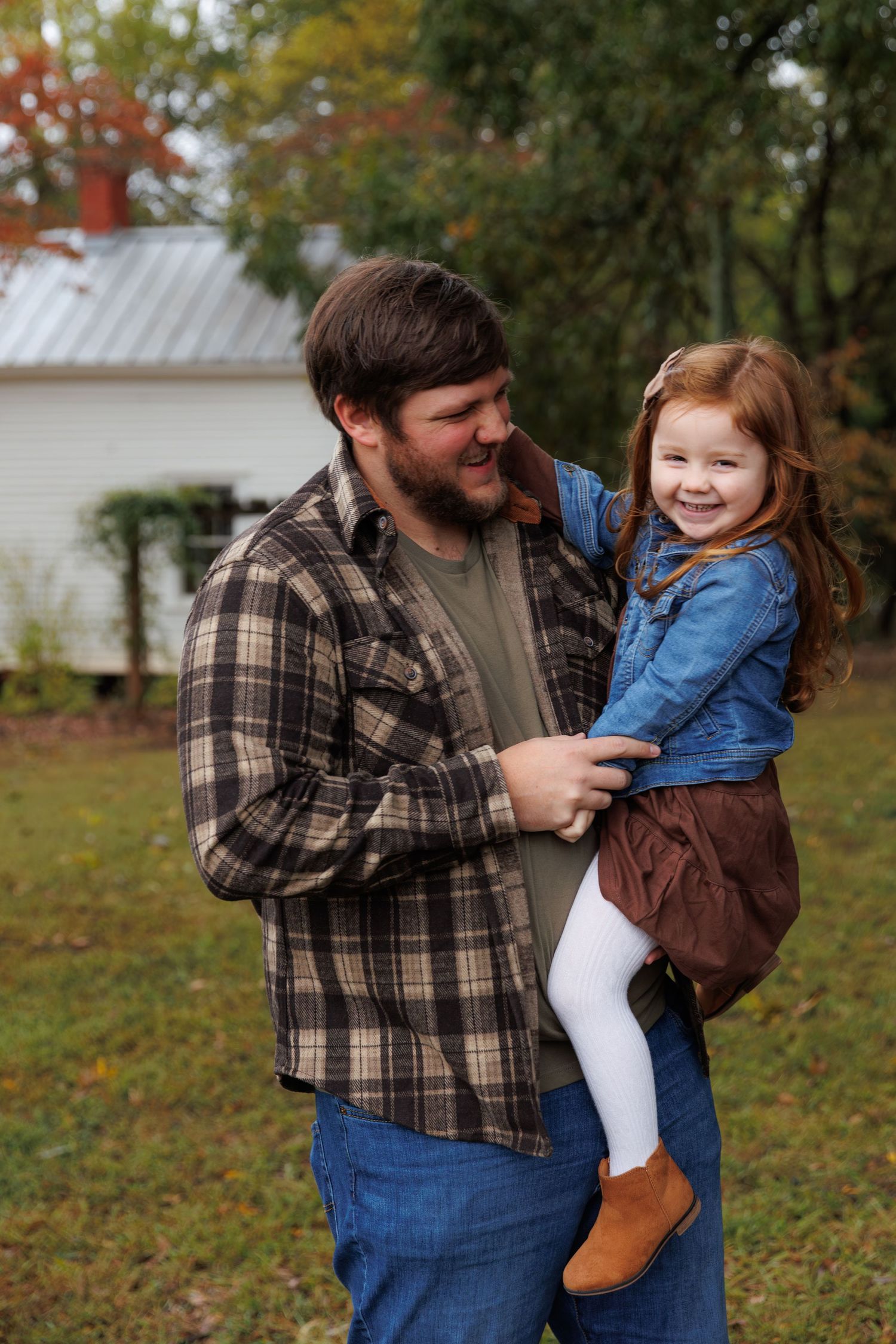 A playful family moment captured in a series of candid shots outdoors on an autumn day.