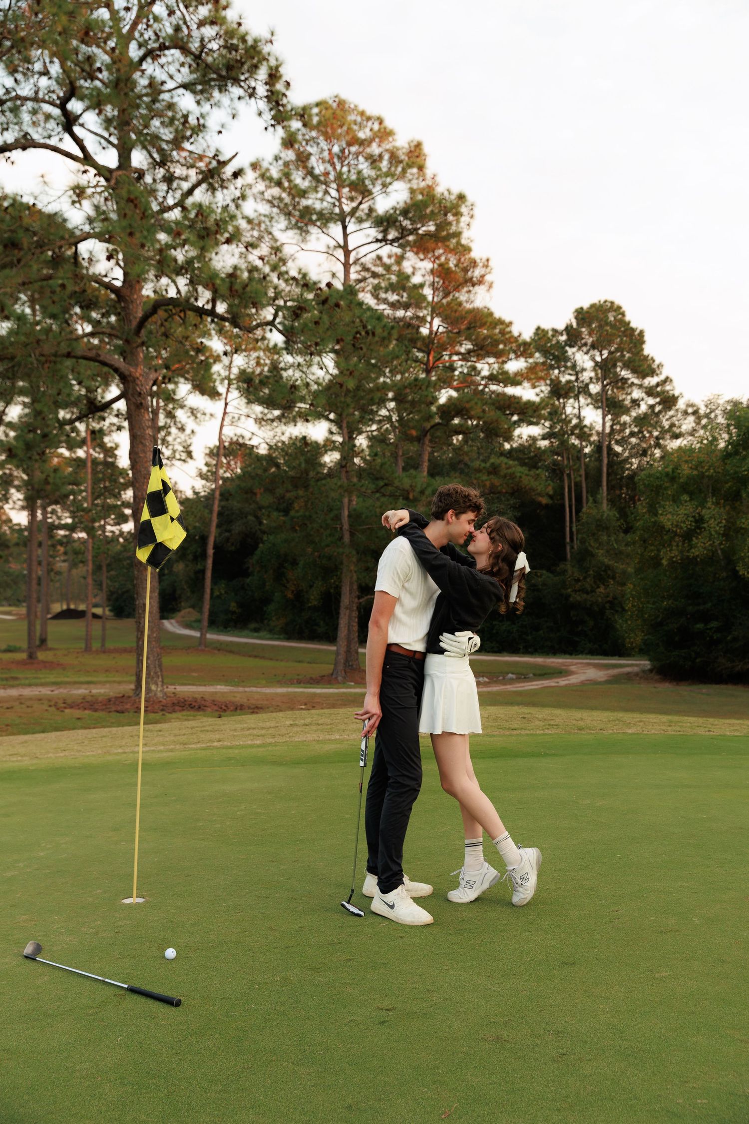 A sequence of golf putting shots shown across four frames on a green course during sunset.