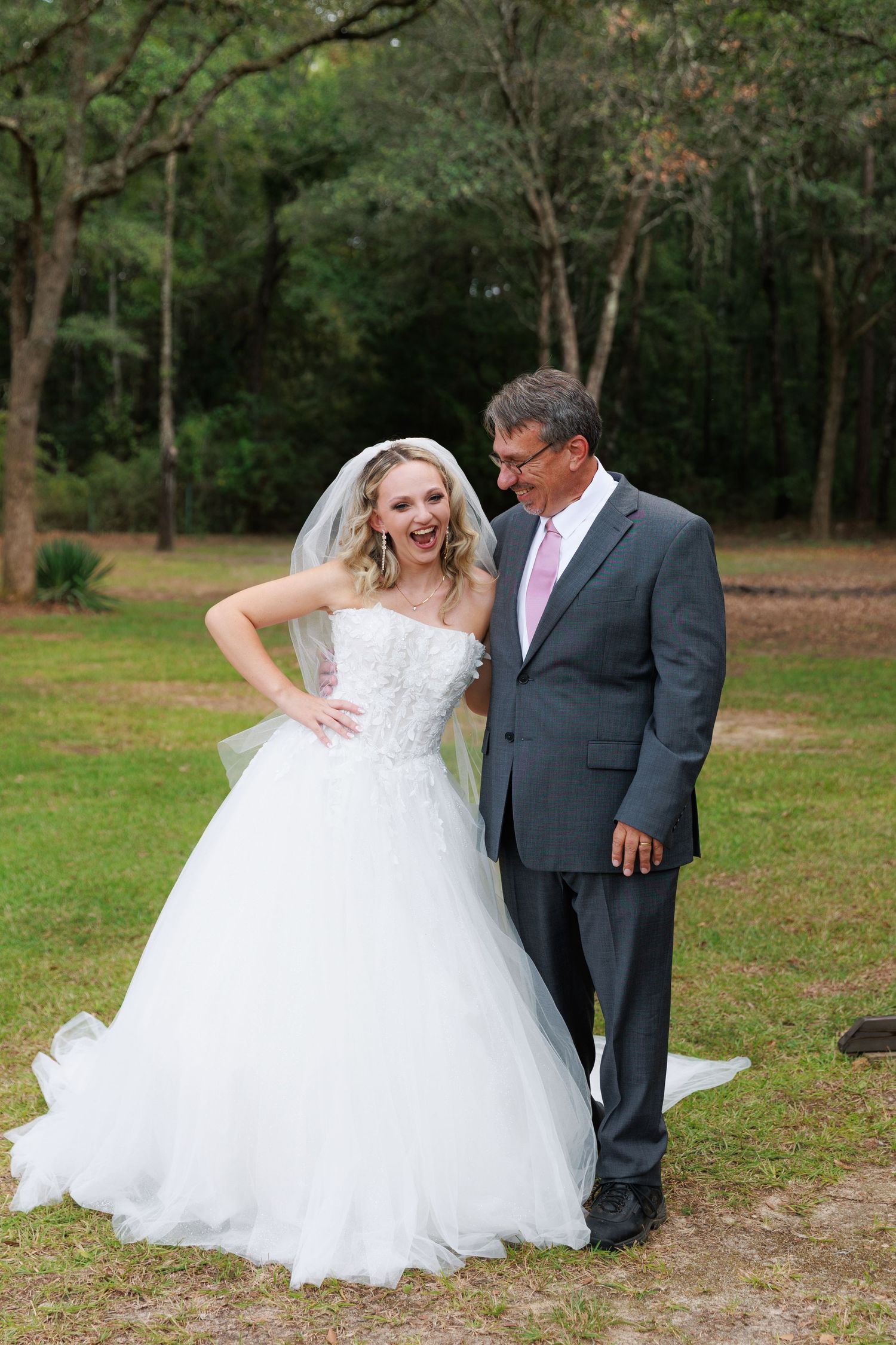 A playful wedding photo sequence showing a couple in formal attire laughing together on grassy grounds.