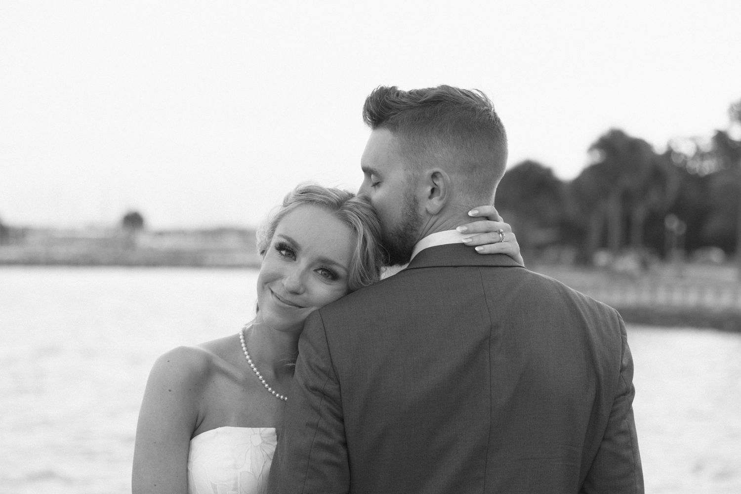 Romantic black and white photo overlooking a peaceful waterfront setting.