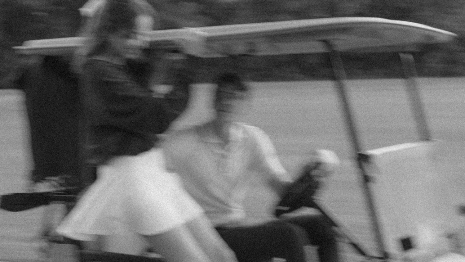 A black and white sequence of action shots showing a skateboarder performing a trick on stairs.
