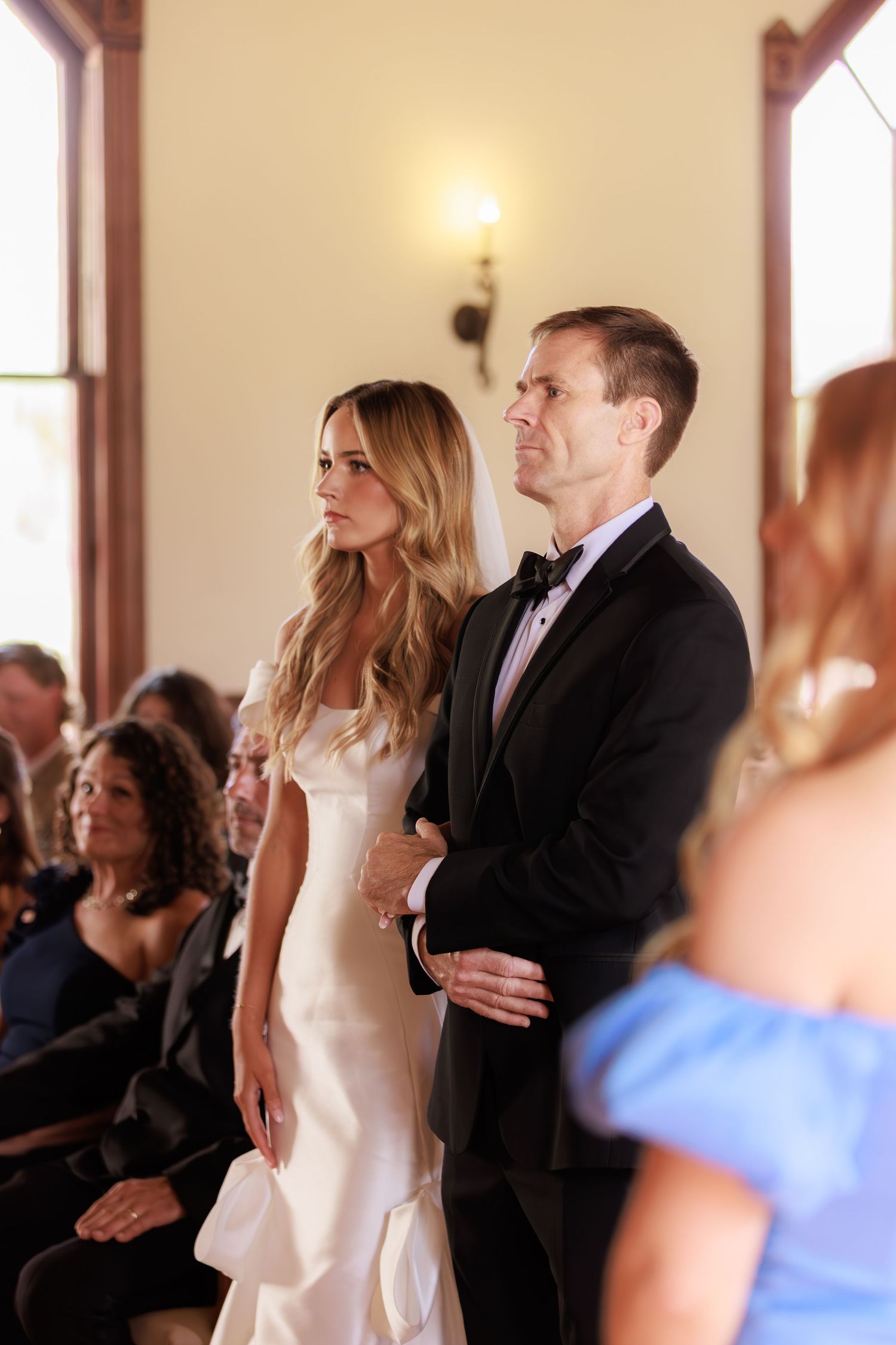 Side by side photos show a couple dancing at a wedding reception in front of guests.