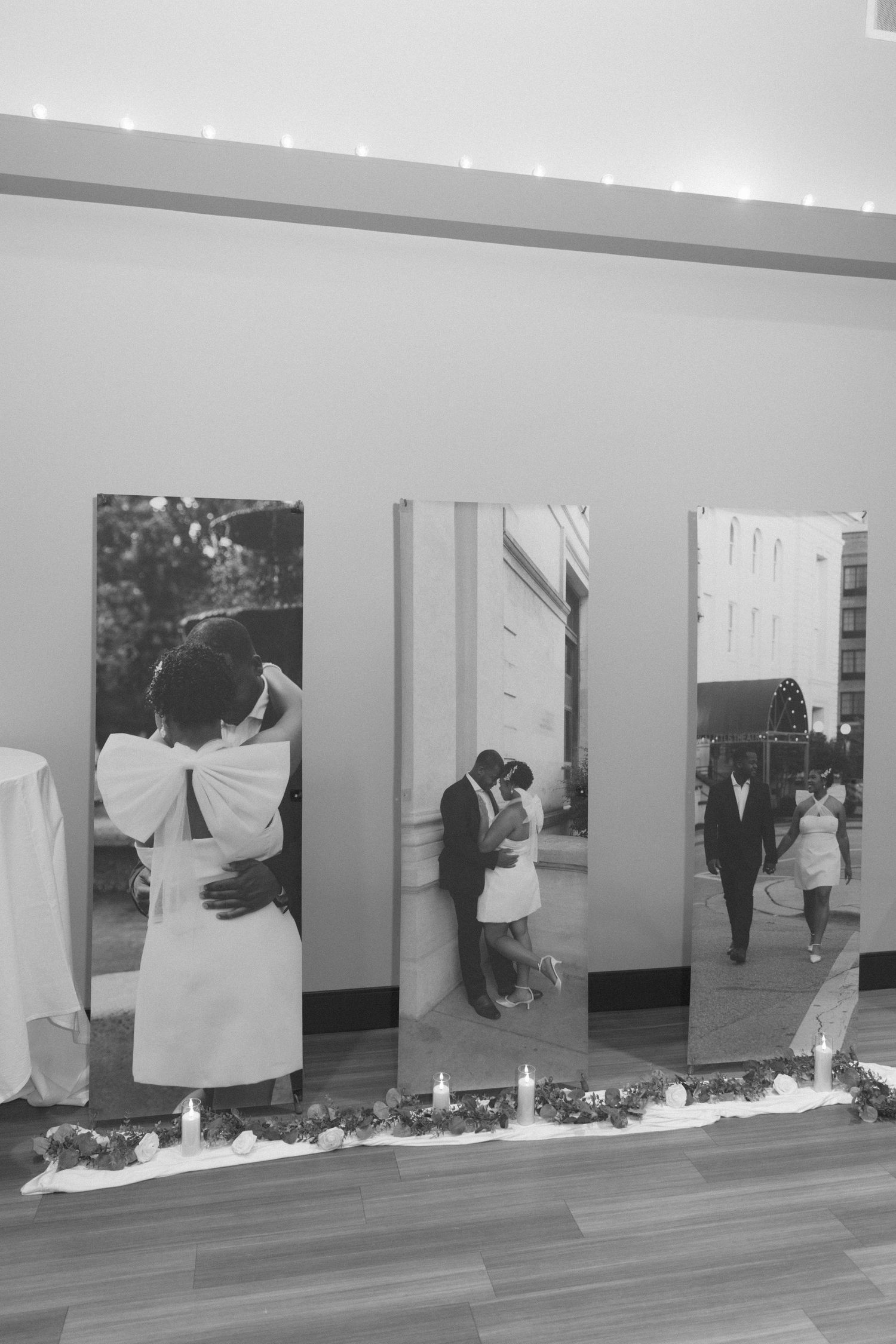 A sequence of black and white photos showing someone interacting with wall panels in an art gallery.