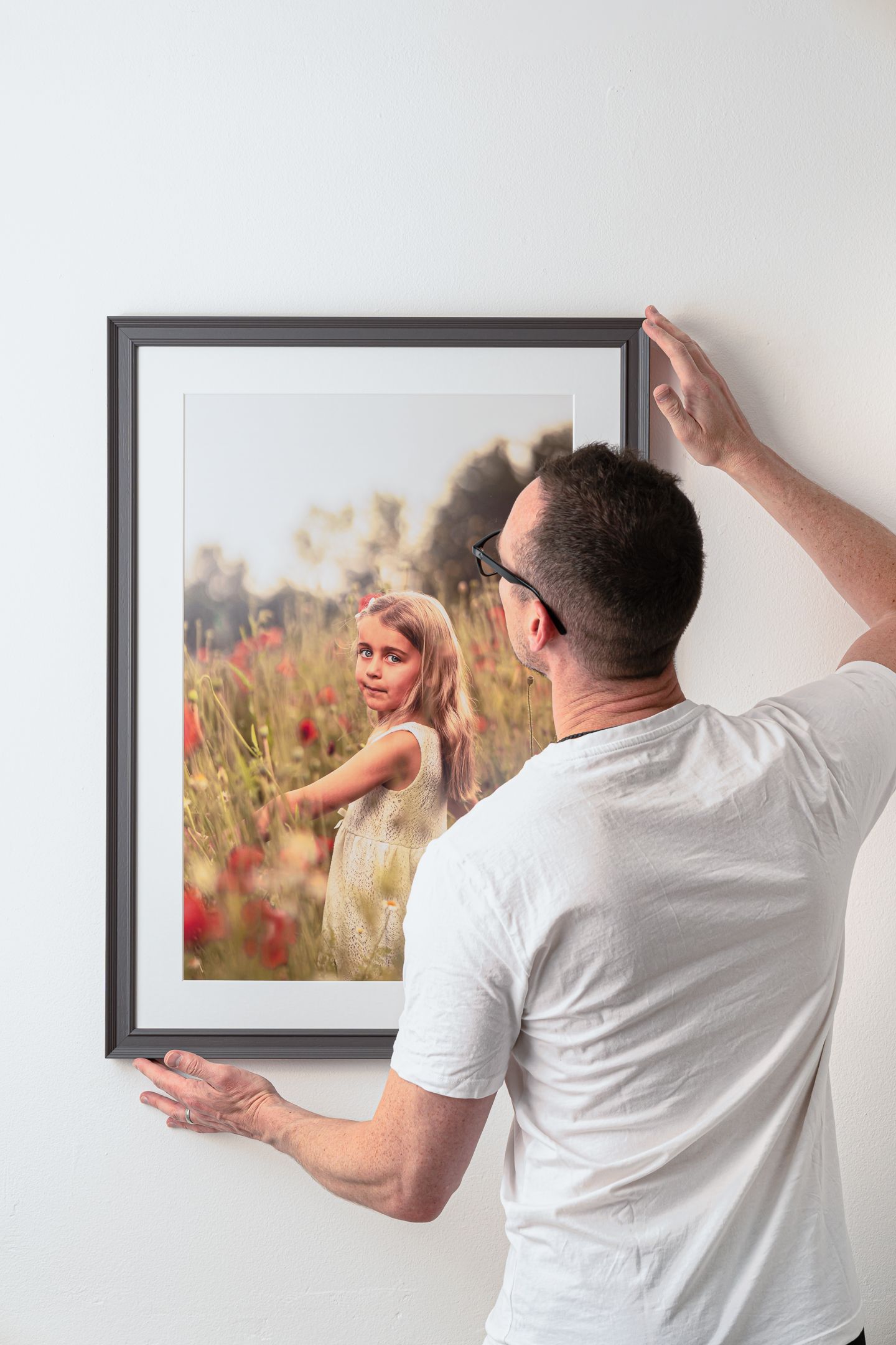 Photography art work being installed on location
