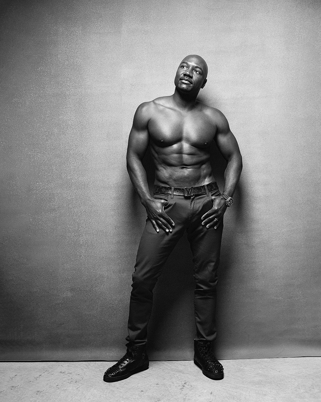 Men artistic black and white fashion photo shoot showing a muscular torso wearing jeans. Atlanta men portrait photography.