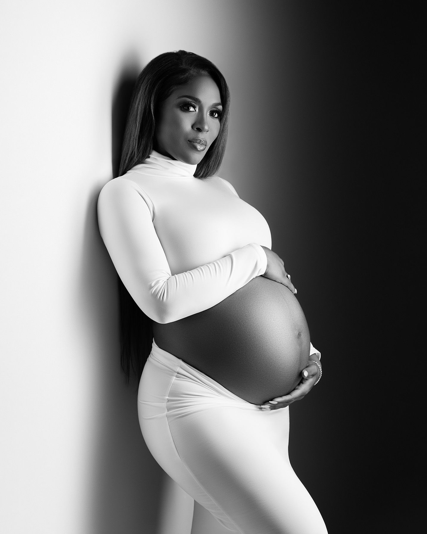 Atlanta maternity photoshoot capturing expecting mother in studio with timeless, editorial style. Studio maternity photography in Atlanta.
