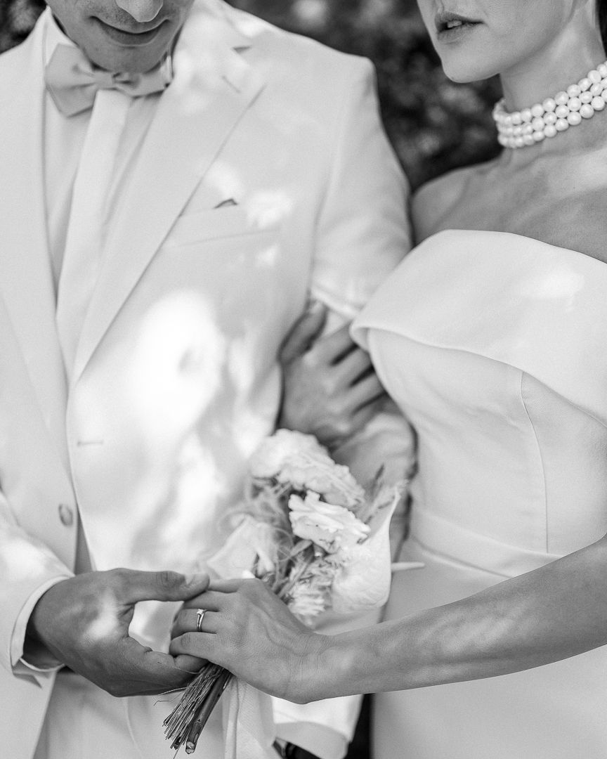 Couple touching – A close-up of a couple touching faces and kissing intimately.