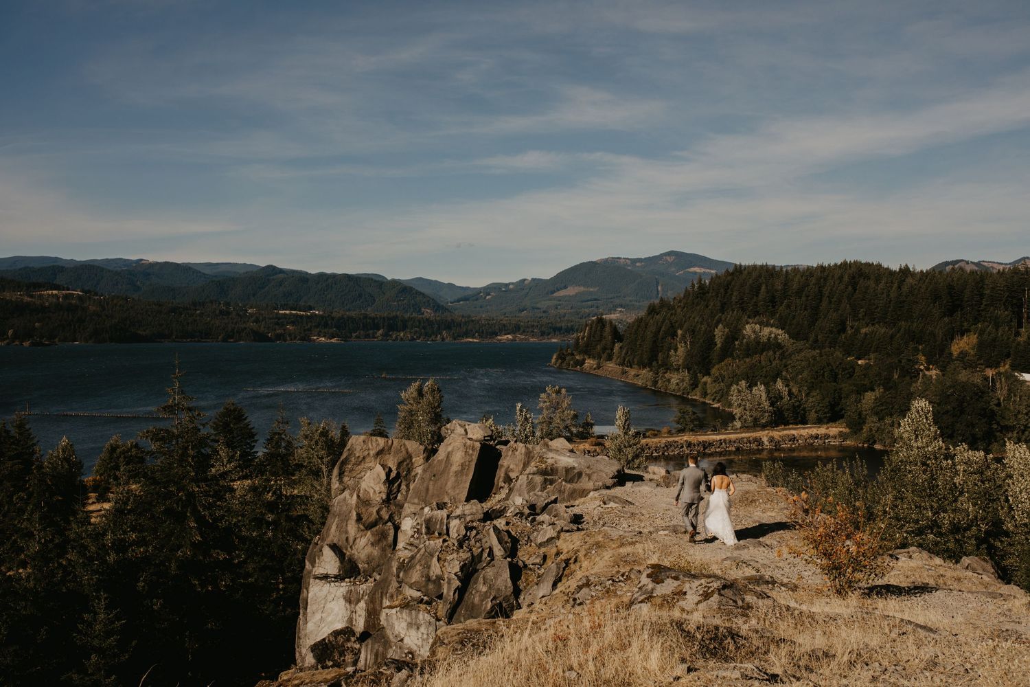 Panoramic mountain vista overlooking Okanagan Lake with dramatic clouds and rugged cliffs in Columbia river gorge