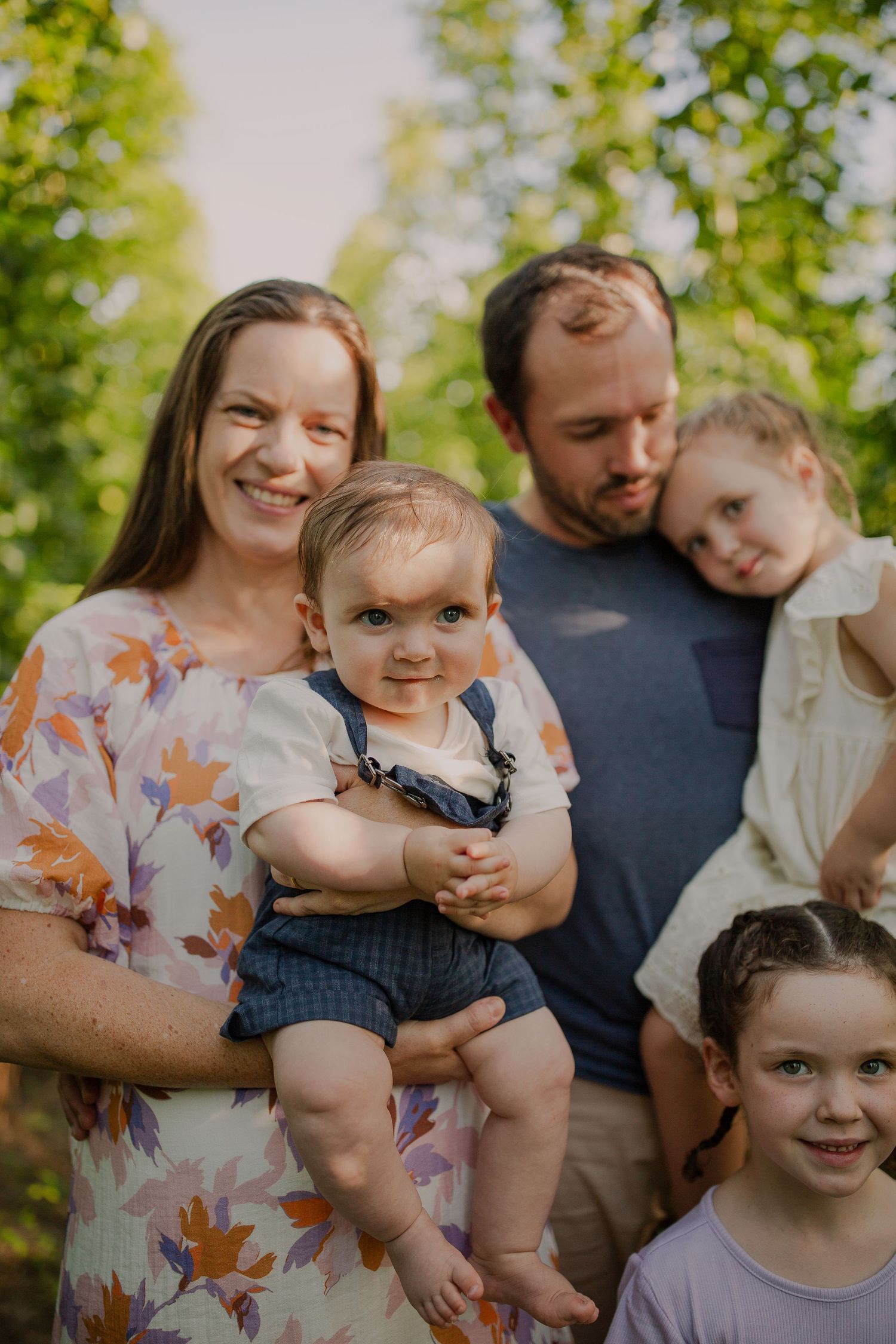 Family photo session in the hops. Colourful portrait.