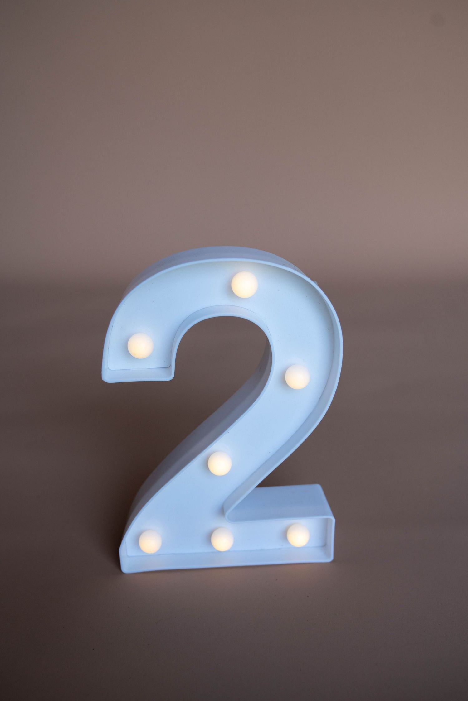 Light blue number 2 with illuminated LED lights shown from various angles.