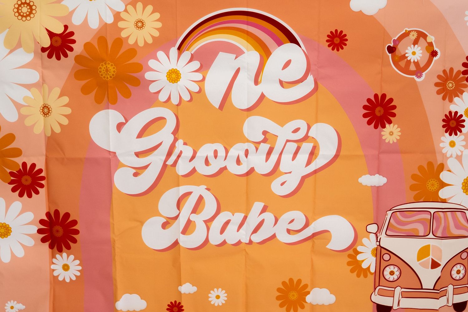 Retro-styled banner with groovy text and floral designs in orange tones.