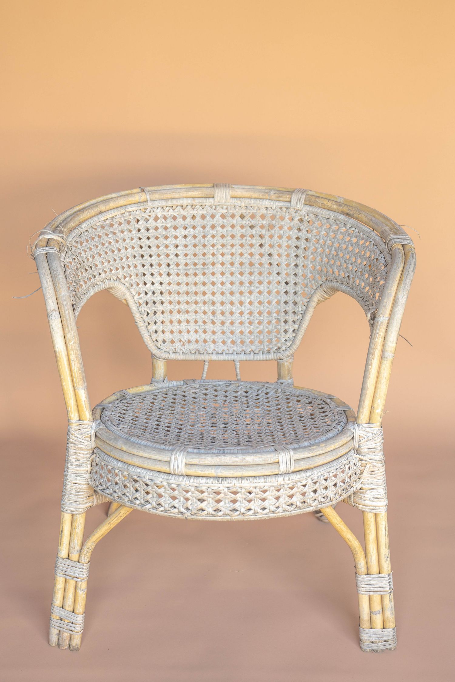 White wicker bench with curved back shown from multiple angles on beige background.