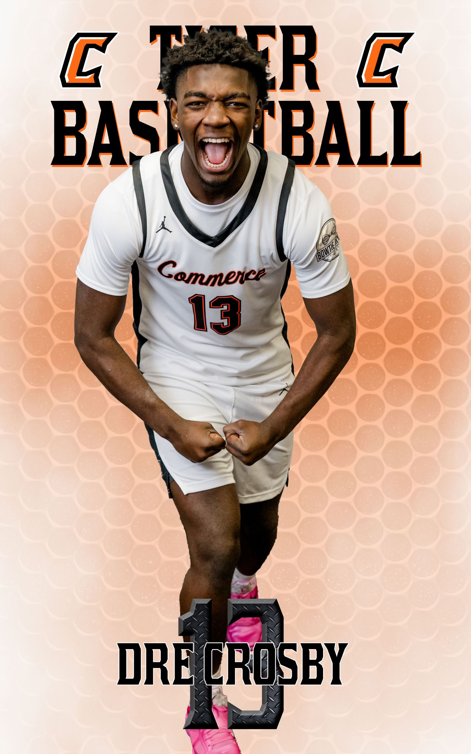 Basketball player wearing number 13 Commerce jersey celebrates enthusiastically on orange honeycomb background.